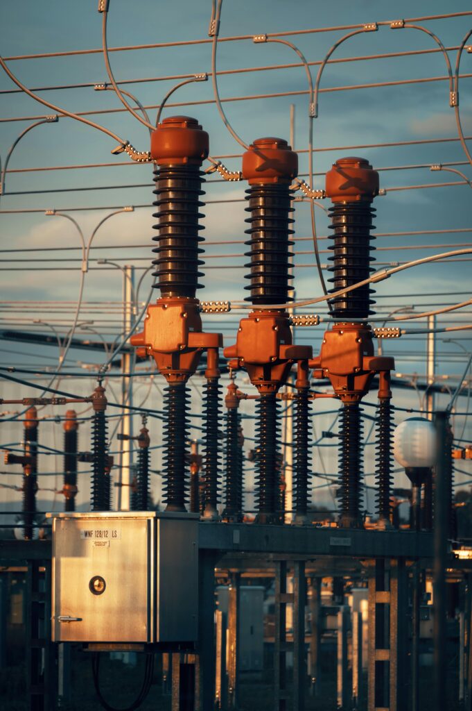 Close-up of high voltage transformers at a power station in Austria during daylight.